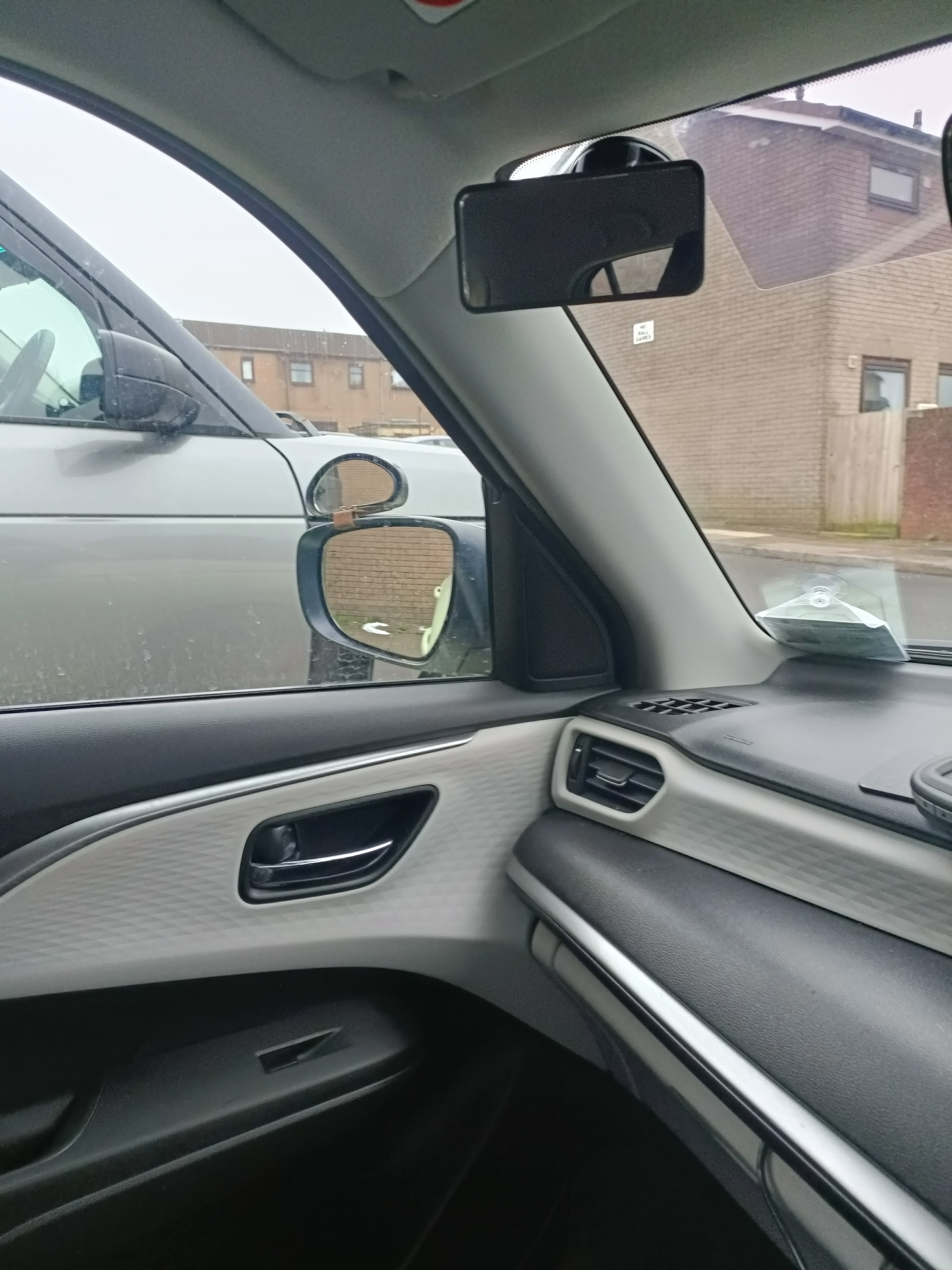 View from the driver’s seat looking toward the left door mirror View from the driver’s seat looking toward the left door mirror