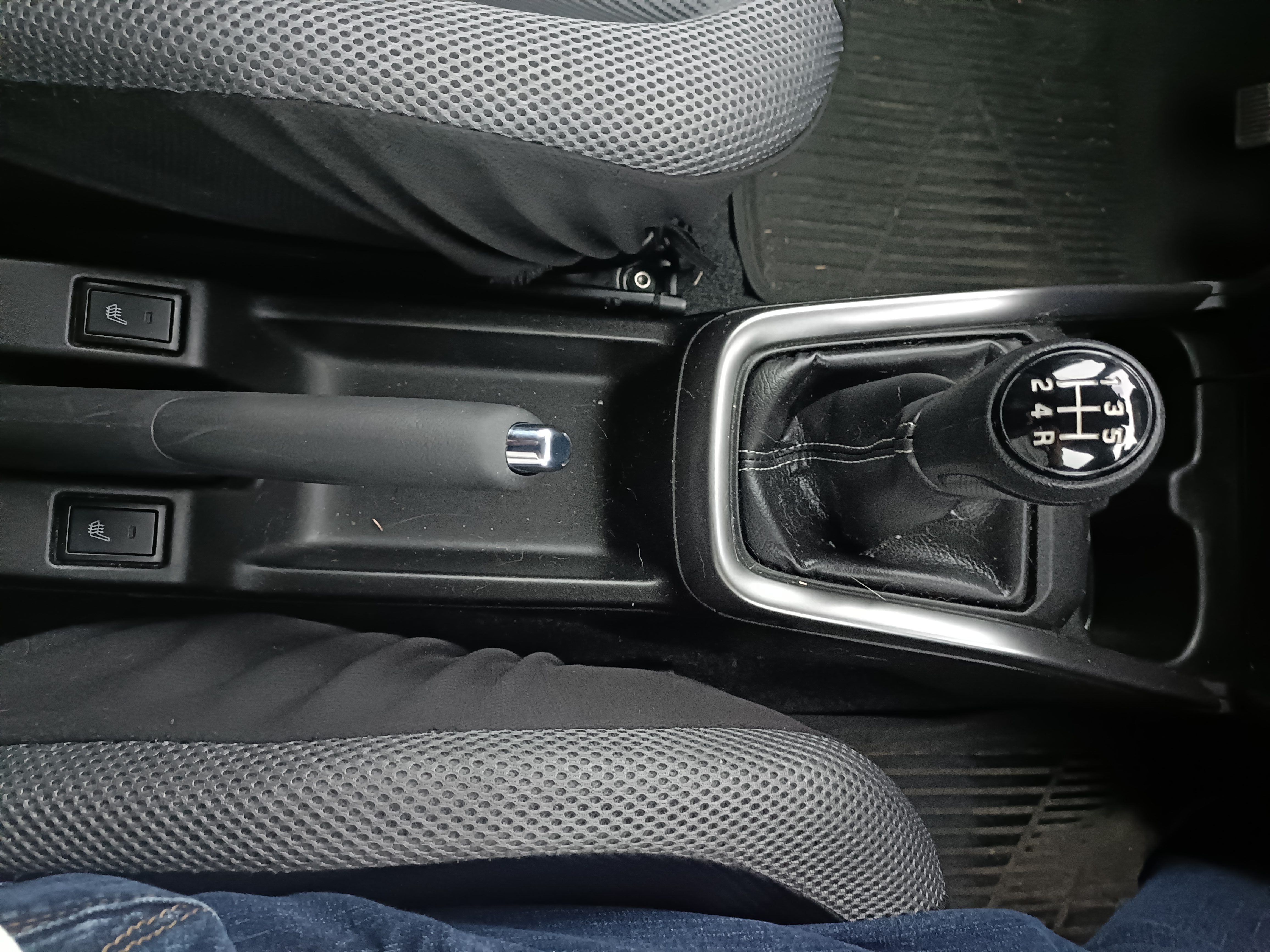 Car’s centre console showing the handbrake and gear lever Car’s centre console showing the handbrake and gear lever