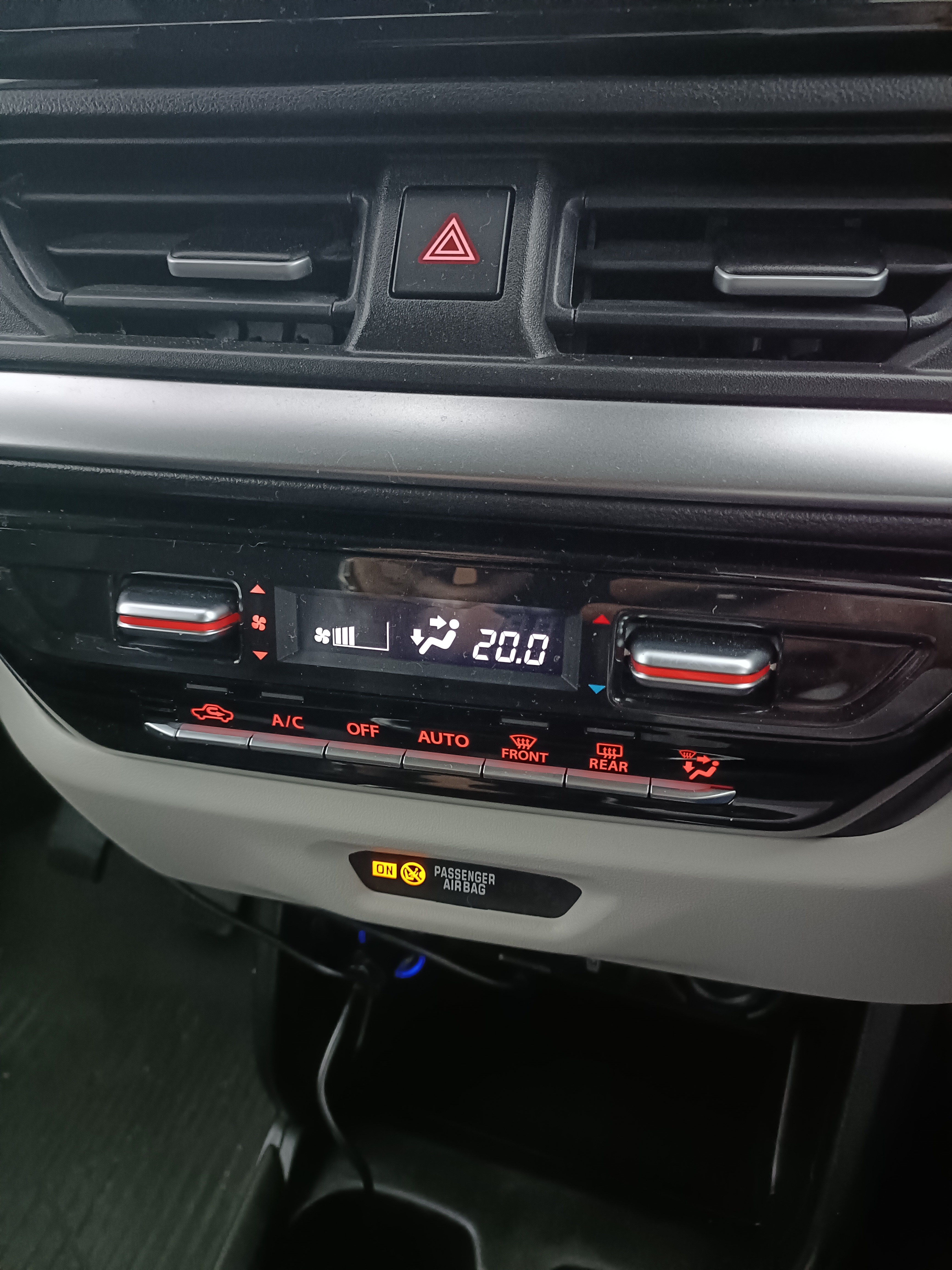 Car’s centre console showing climate controls, media buttons and system settings Car’s centre console showing climate controls, media buttons and system settings